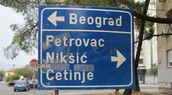 Road sign to Belgrade and cities in Montenegro, Podgorica. 